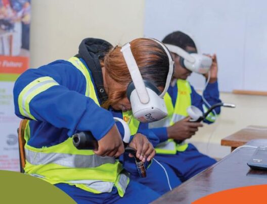 Person with VR glasses und welding tool